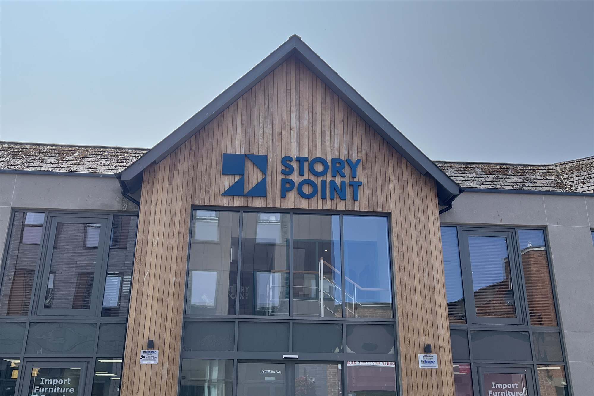 StoryPoint in Hereford, a timber-clad gable with the StoryPoint sign above a glazed entrance.